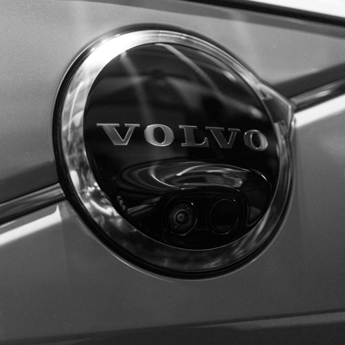 Volvo sign with a camera lens